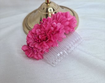 Bright pink flower comb