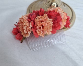Coral red and peach flower comb